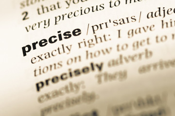 Close up of old English dictionary page with word precise