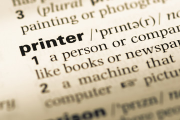 Close up of old English dictionary page with word printer