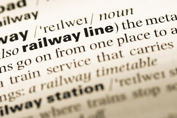 Close up of old English dictionary page with word railway line