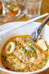 Asian spicy seafood noodle soup with shrimp and mantis shrimp delicious Chinese food.