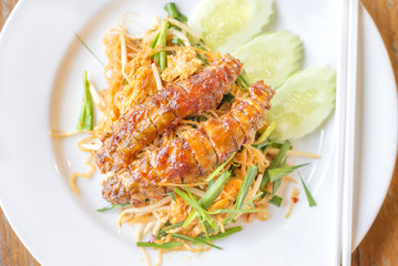 Pad Thai noodle, stir fried rice noodles with crayfish or mantis shrimp, is the popular of Thailand's national main dish.