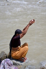 Women pray in Ganges River