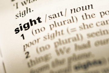 Close up of old English dictionary page with word sight