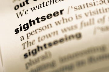 Close up of old English dictionary page with word sightseer