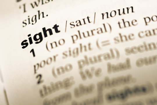 Close up of old English dictionary page with word sight