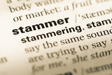 Close up of old English dictionary page with word stammer