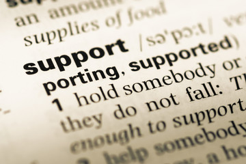 Obraz premium Close up of old English dictionary page with word support