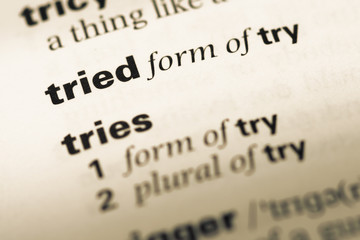 Close up of old English dictionary page with word tried