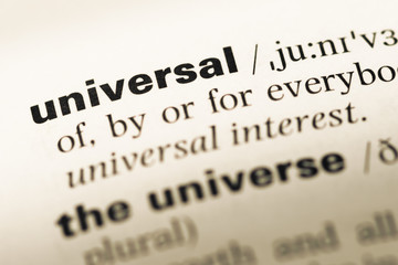 Close up of old English dictionary page with word universal
