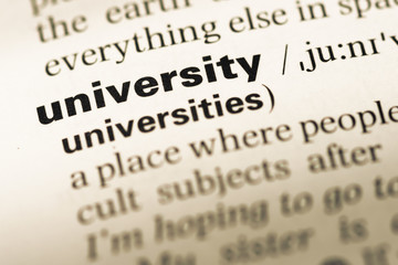 Close up of old English dictionary page with word university