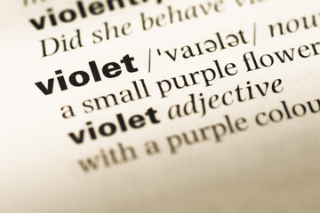 Close up of old English dictionary page with word violet © TungCheung