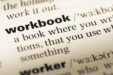 Obraz premium Close up of old English dictionary page with word workbook