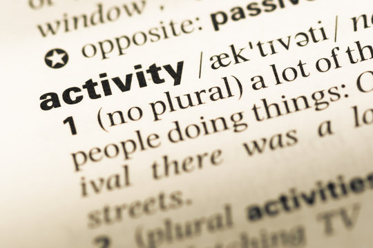 Close up of old English dictionary page with word activity