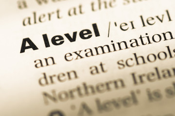 Obraz premium Close up of old English dictionary page with word A level