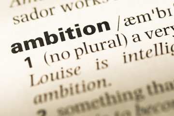 Close up of old English dictionary page with word ambition