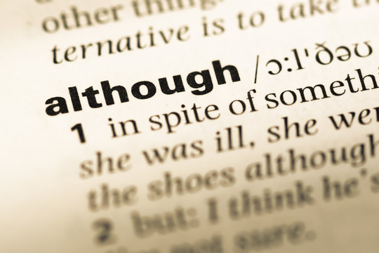 Close up of old English dictionary page with word although