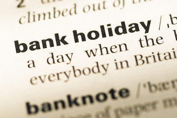 Fototapeta premium Close up of old English dictionary page with word bank holiday