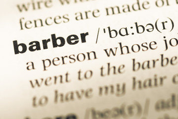 Close up of old English dictionary page with word barber