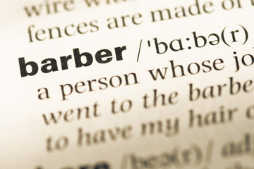 Close up of old English dictionary page with word barber