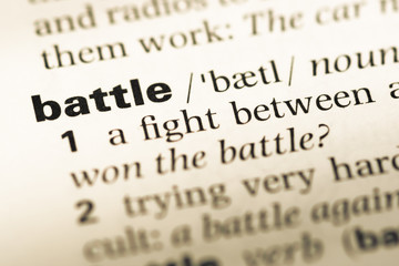 Fototapeta premium Close up of old English dictionary page with word battle