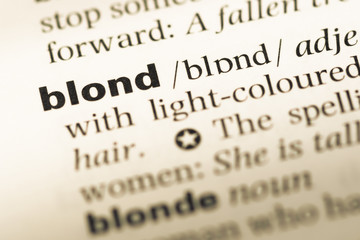 Obraz premium Close up of old English dictionary page with word blond