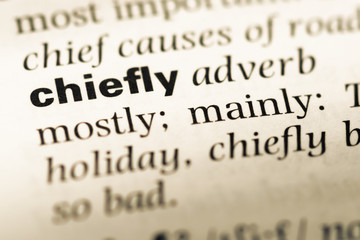 Obraz premium Close up of old English dictionary page with word chiefly