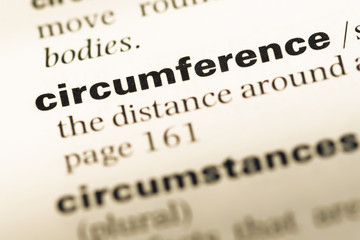 Obraz premium Close up of old English dictionary page with word circumference