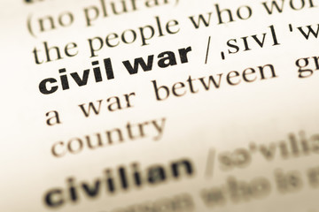 Close up of old English dictionary page with word civil war