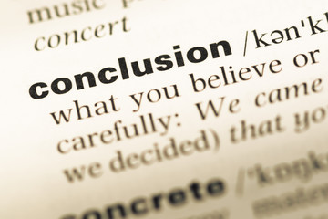 Close up of old English dictionary page with word conclusion