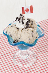 cookies and cream in blue glass with mini canada flag