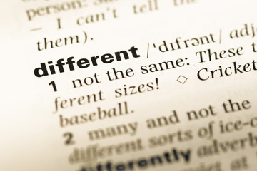 Close up of old English dictionary page with word different