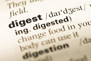 Close up of old English dictionary page with word digest