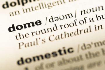 Obraz premium Close up of old English dictionary page with word dome