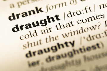 Obraz premium Close up of old English dictionary page with word draught