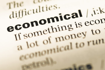 Obraz premium Close up of old English dictionary page with word economical