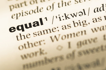 Close up of old English dictionary page with word equal