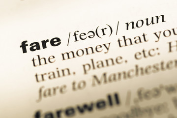 Fototapeta premium Close up of old English dictionary page with word fare