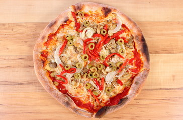 Italian vegetarian pizza on wooden surface