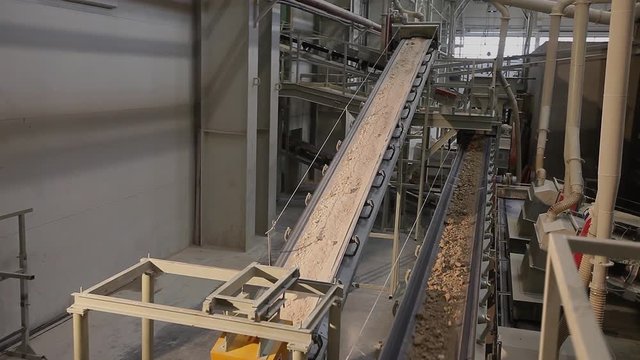 &ETH;&iexcl;onveyor belt on factory. Transportation of clay on the conveyor, Transportation of raw materials on the conveyor. A clay belt conveyor.  Raw materials warehouse