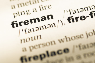 Close up of old English dictionary page with word firemen