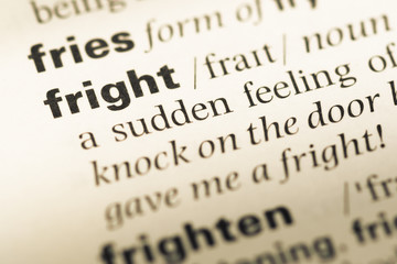 Obraz premium Close up of old English dictionary page with word fright