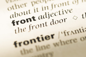 Close up of old English dictionary page with word front