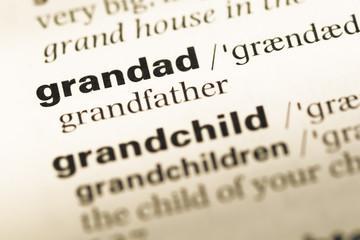 Close up of old English dictionary page with word grandad