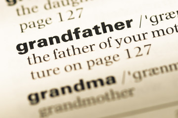 Close up of old English dictionary page with word grandfather