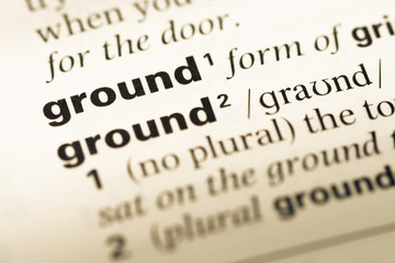Obraz premium Close up of old English dictionary page with word ground