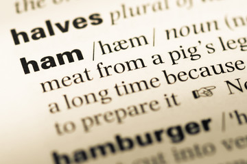 Obraz premium Close up of old English dictionary page with word ham