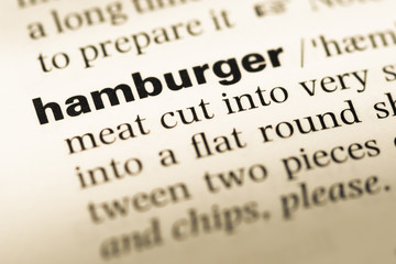 Close up of old English dictionary page with word hamburger