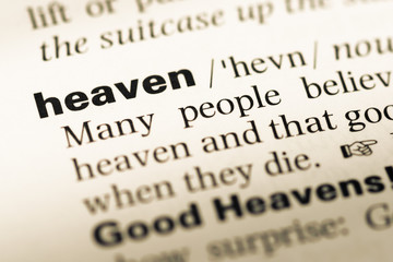 Obraz premium Close up of old English dictionary page with word heaven