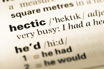 Close up of old English dictionary page with word hectic