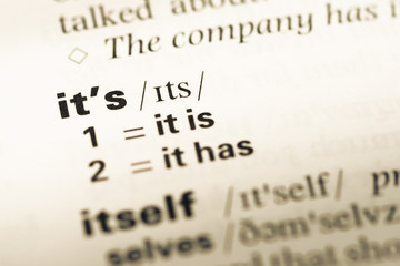 Close up of old English dictionary page with word its